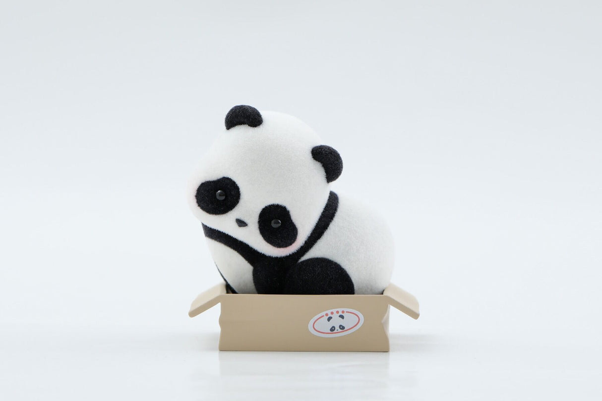 Panda Roll Panda As A Cat blind box figure sitting inside cardboard box