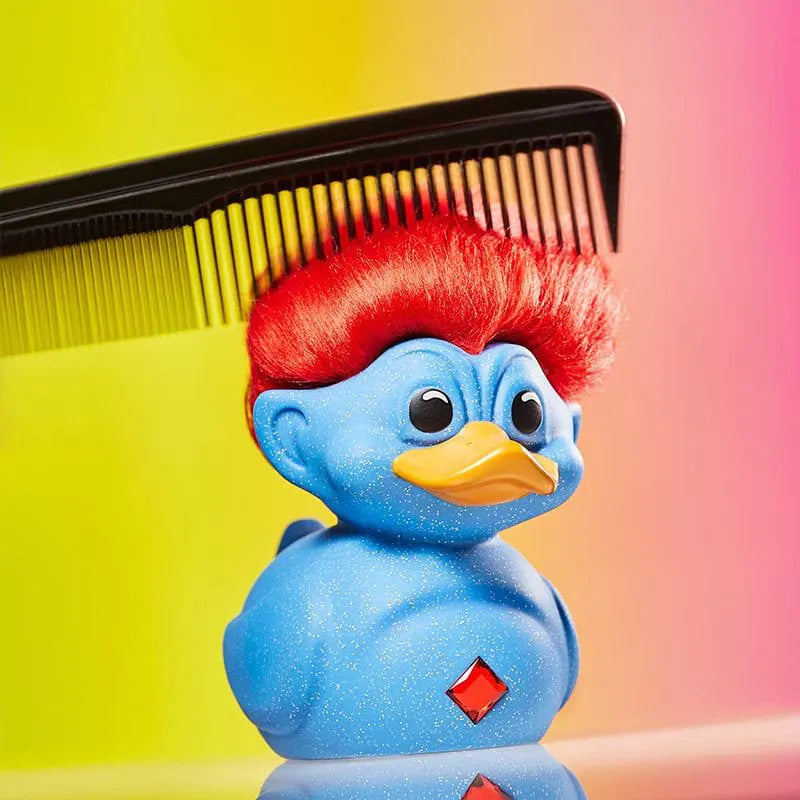 Troll duck getting its red hair combed – playful styling