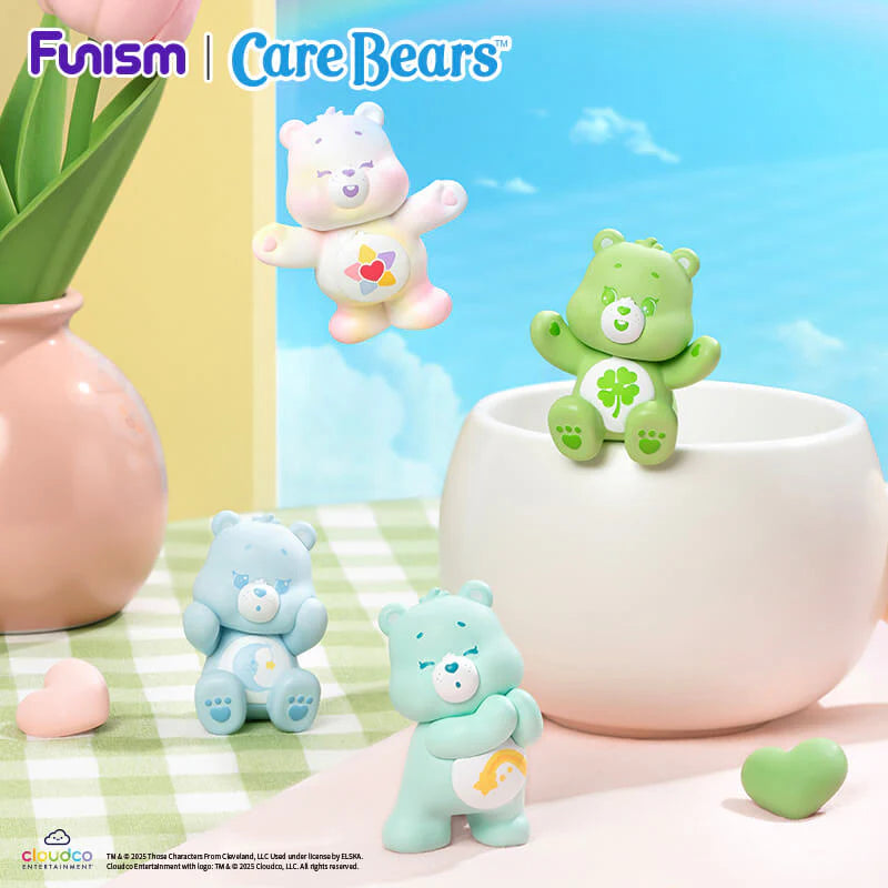 Care Bears Little Things Cubby Face Series featuring several bears gathered around a flower pot