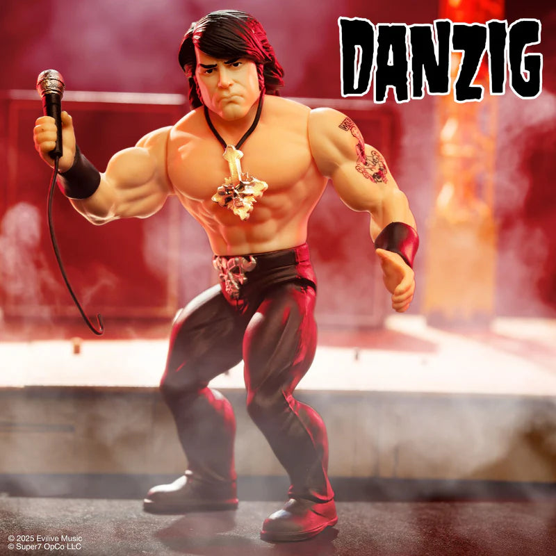 Glenn Danzig vintage action figure holding a microphone with intense red stage lighting
