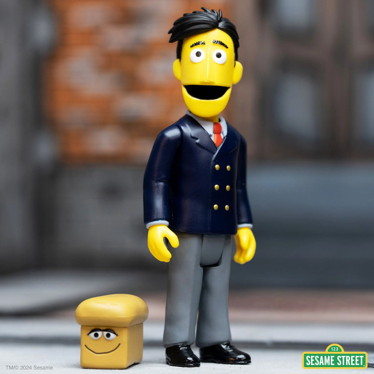 Guy Smiley action figure with bread accessory