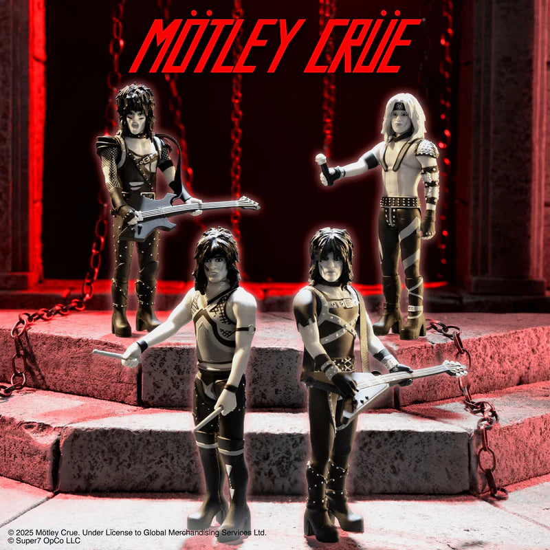 Mötley Crüe Nikki Sixx ReAction figure posed on red stage with band, holding bass guitar