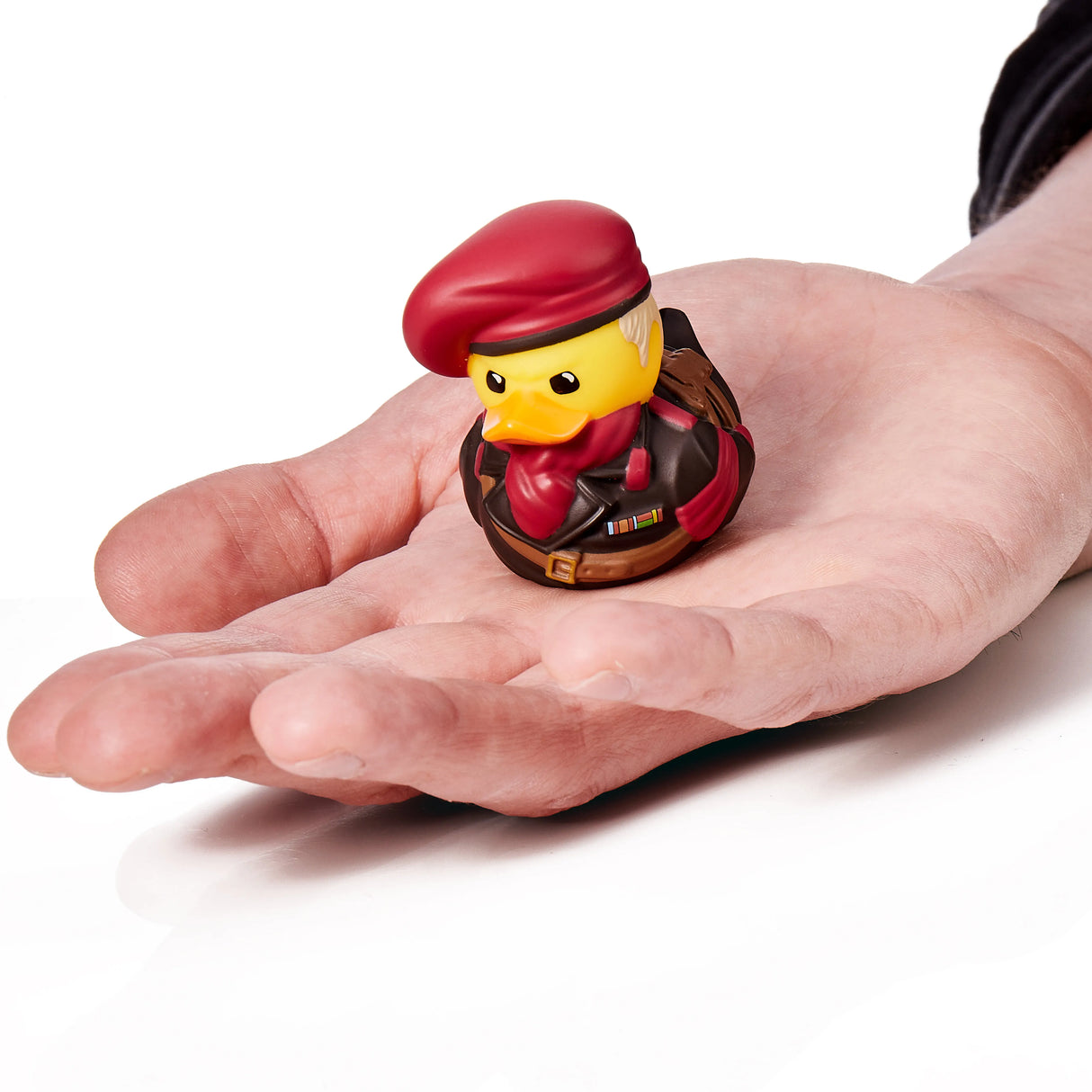 Revolver Ocelot duck figure displayed on a hand