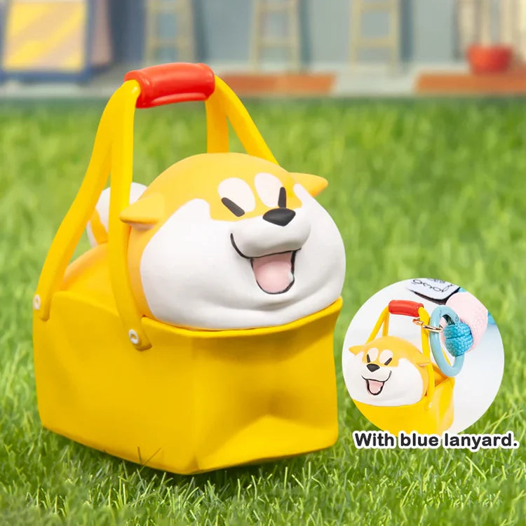 Puppy Crossing blind box collectible Shiba inside a yellow basket with blue lanyard