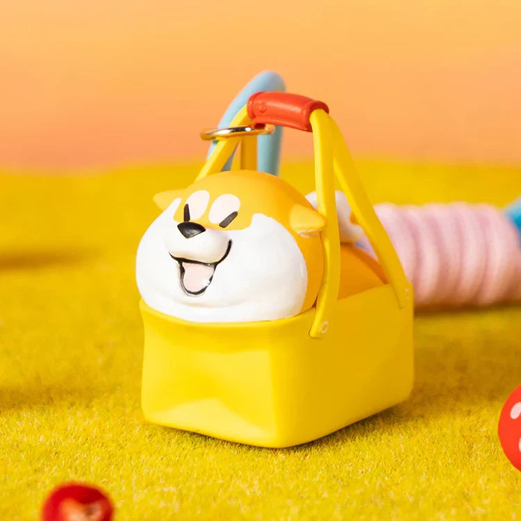 Puppy Crossing blind box Shiba in a yellow basket with red handle and blue lanyard