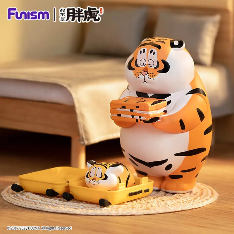 Tiger figure with suitcase packing baby tiger collectible vinyl from Funism.