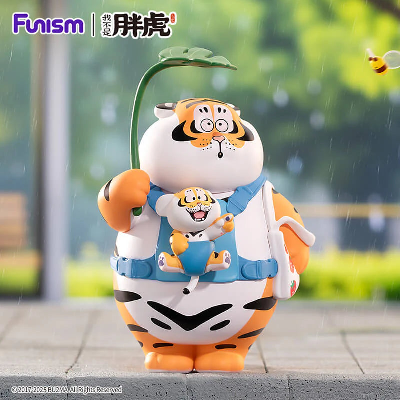 Fat Tiger holding baby tiger in carrier under leaf umbrella vinyl figure.