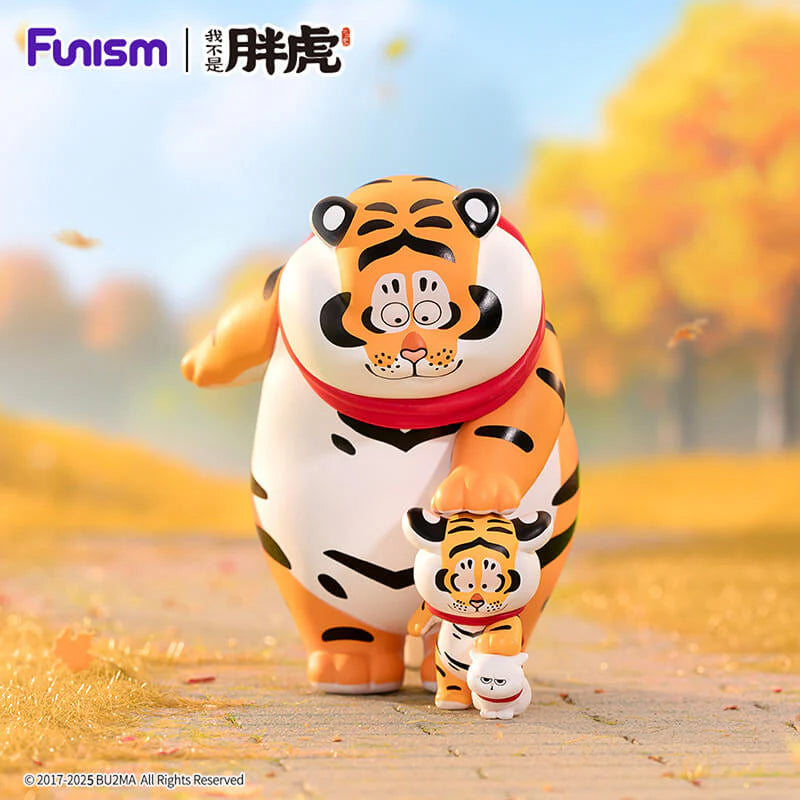 Fat Tiger walking with cub on autumn path collectible vinyl art toy.