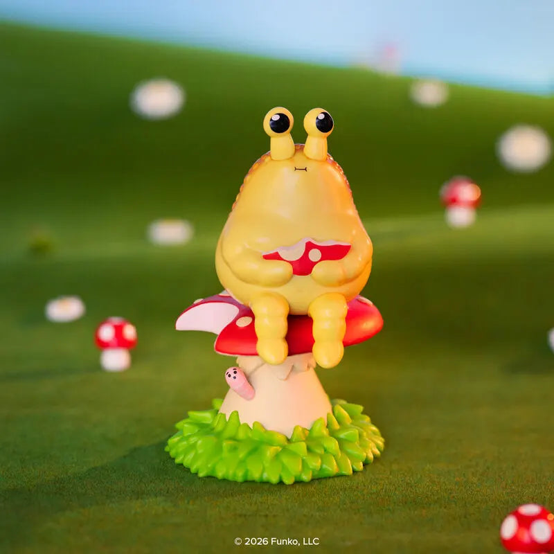 Blonks frog figure sitting on mushroom nature scene
