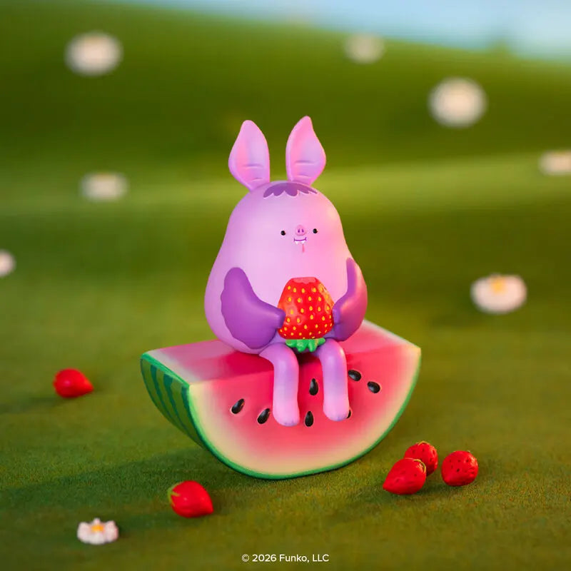 Blonks fruit bat figure sitting on watermelon holding strawberry