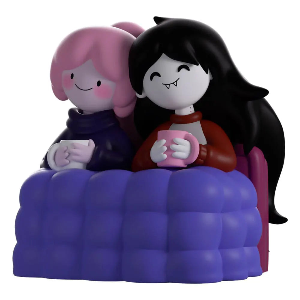 Front view of Bonnie and Marcy Youtooz vinyl figure from Adventure Time, sitting together under a purple quilt with mugs in hand.