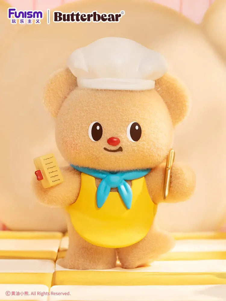 Butterbear with white chef hat and yellow apron holding a menu – bakery collectible