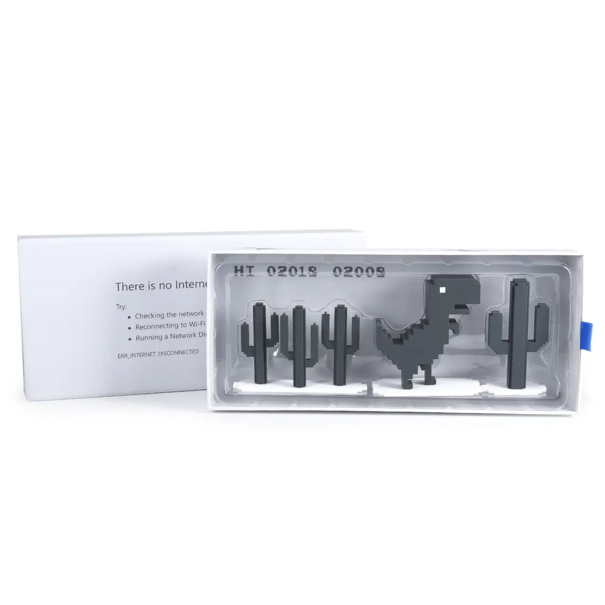 Chrome Dino toy inside its plastic tray with packaging insert visible.