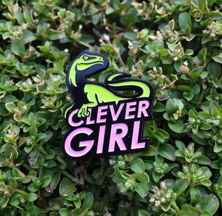 Yesterdays Clever Girl enamel pin on original collector card packaging