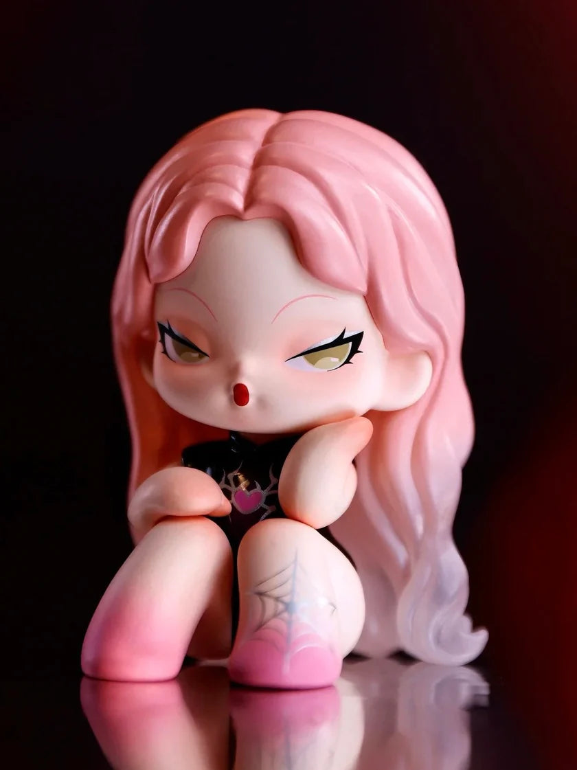 DODO Nami blindbox character with pink ombre hair and spider web tattoo on leg.