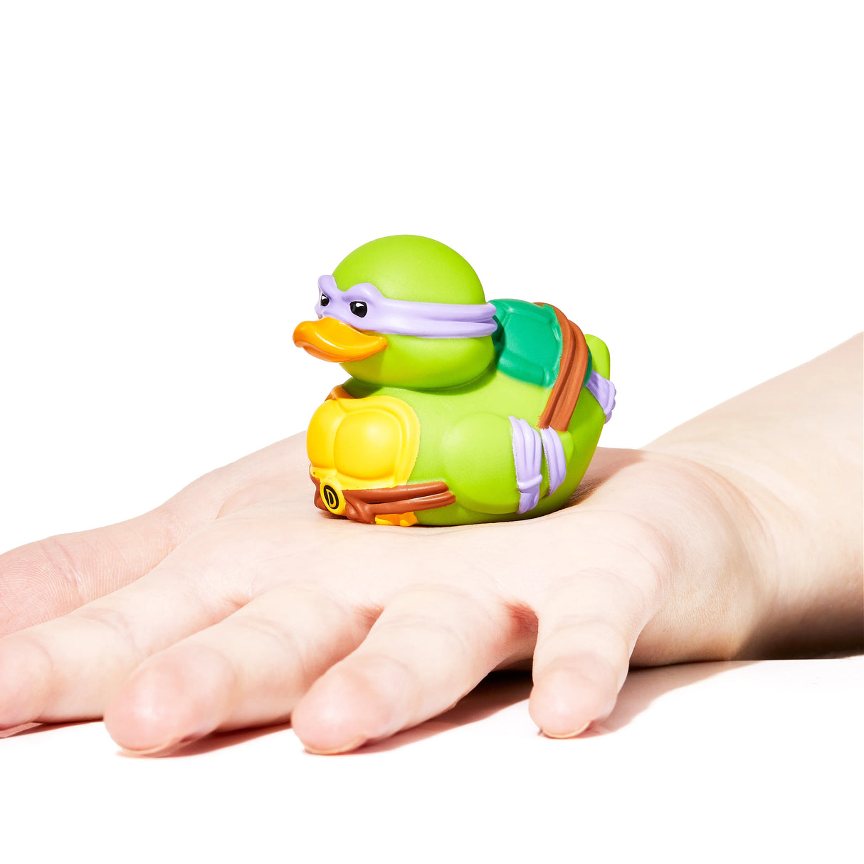 Donatello Mini TUBBZ displayed on an open hand for scale