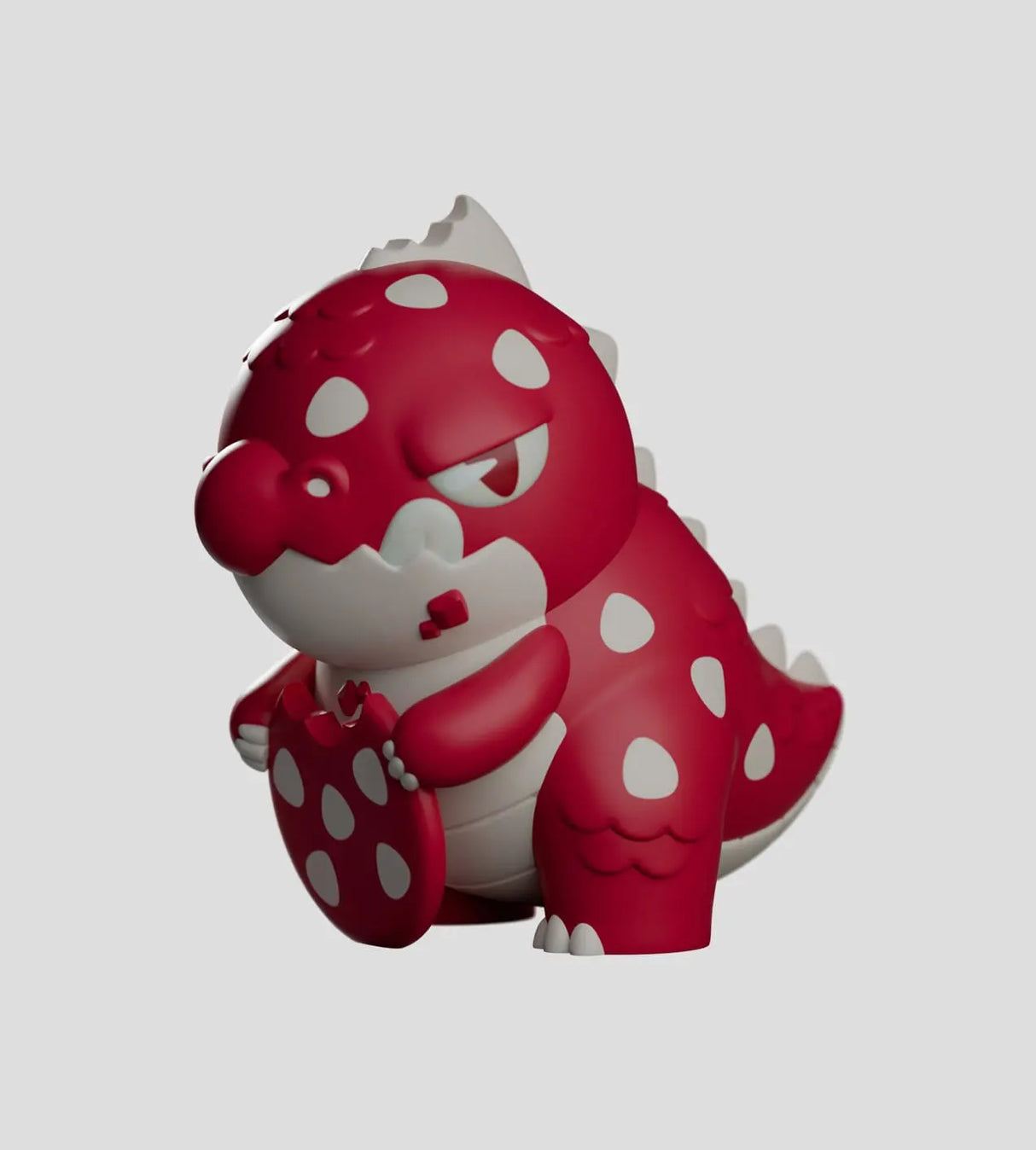 Red and white Dread Friends kaiju collectible figure holding a cookie