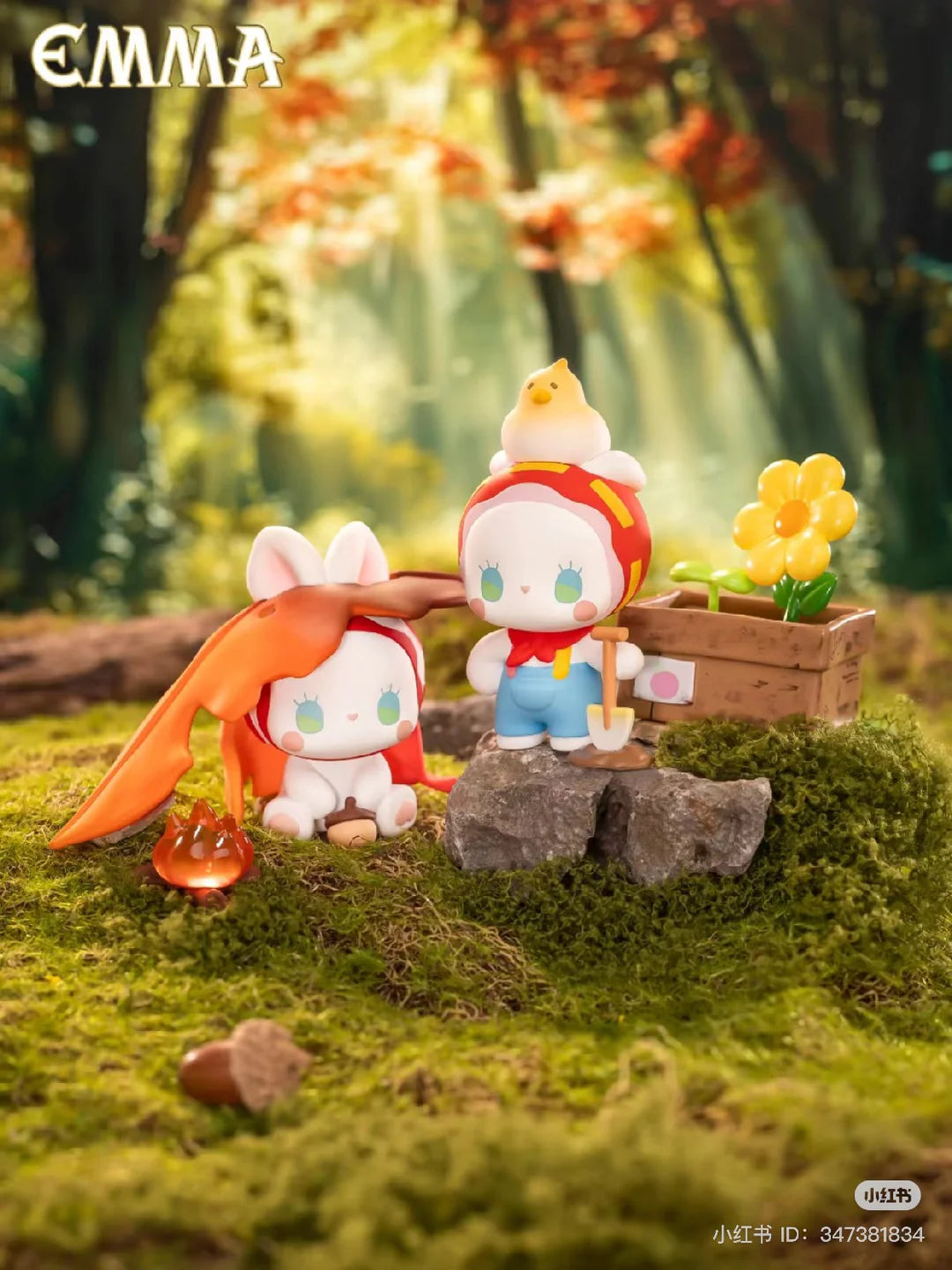 EMMA Fairy Babe Academy Seeky Peeky Boop and Loosey Goosey Boopity figures outdoors with a campfire and flowers.