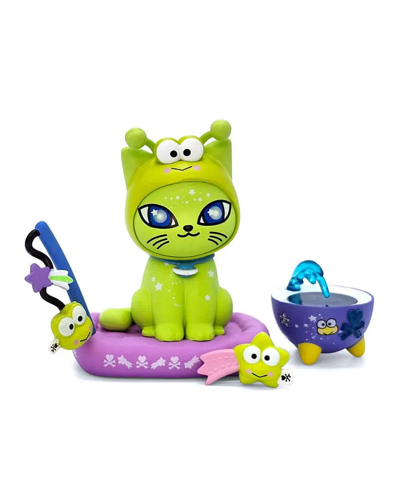 Tokidoki x Hello Kitty Galactic Cats collectible figure featuring Keroppi-themed green cat with accessories including cushion, bowl, and star toy.