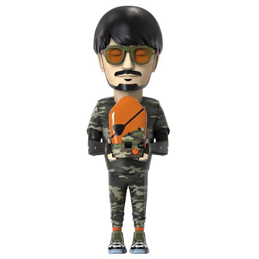 Front view of Game Designer (Boss Edition) vinyl figure wearing camo and holding BB unit.