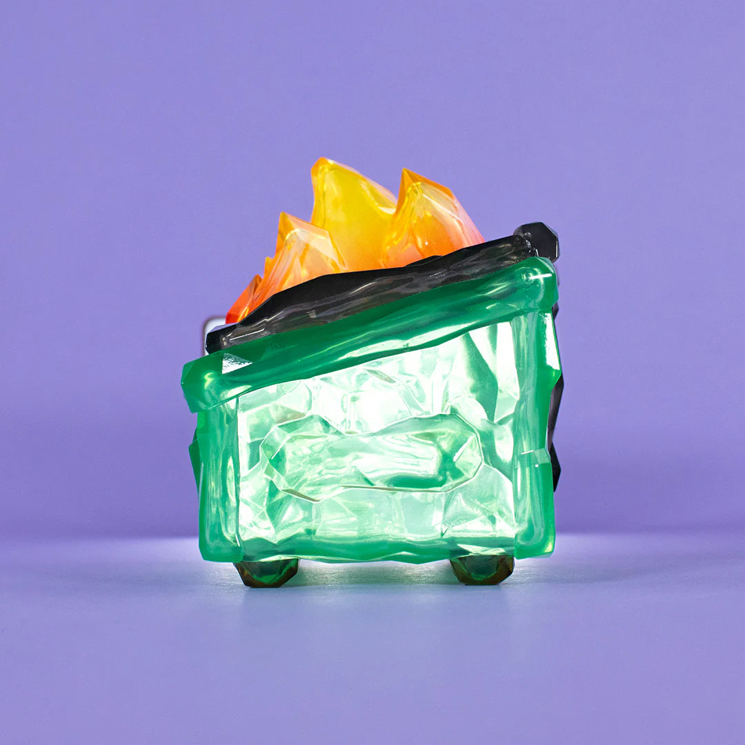 Angled view of Gem Dumpster Fire vinyl figure showing translucent gemstone body