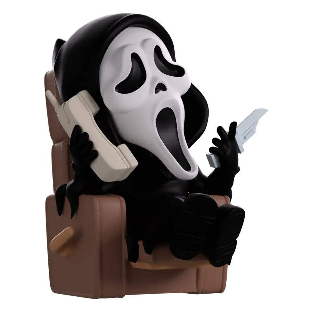 Ghostface Youtooz figure sitting on recliner with phone and knife
