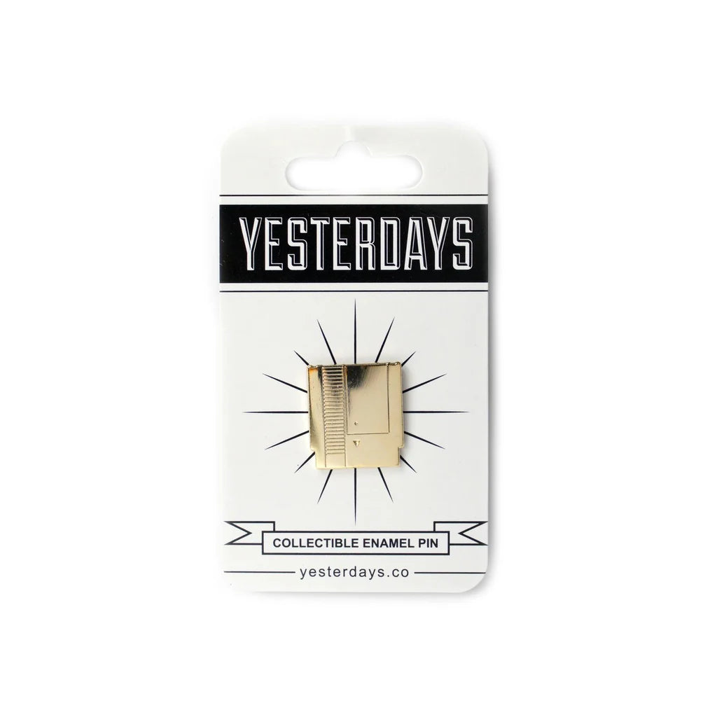 Polished gold enamel lapel pin inspired by classic video games