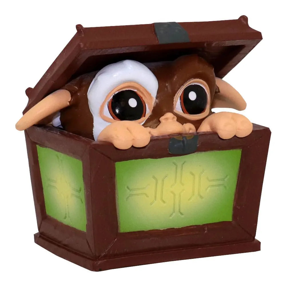 Gizmo peeking out of a wooden box mini figure from Gremlins Blind Box Wave 1.