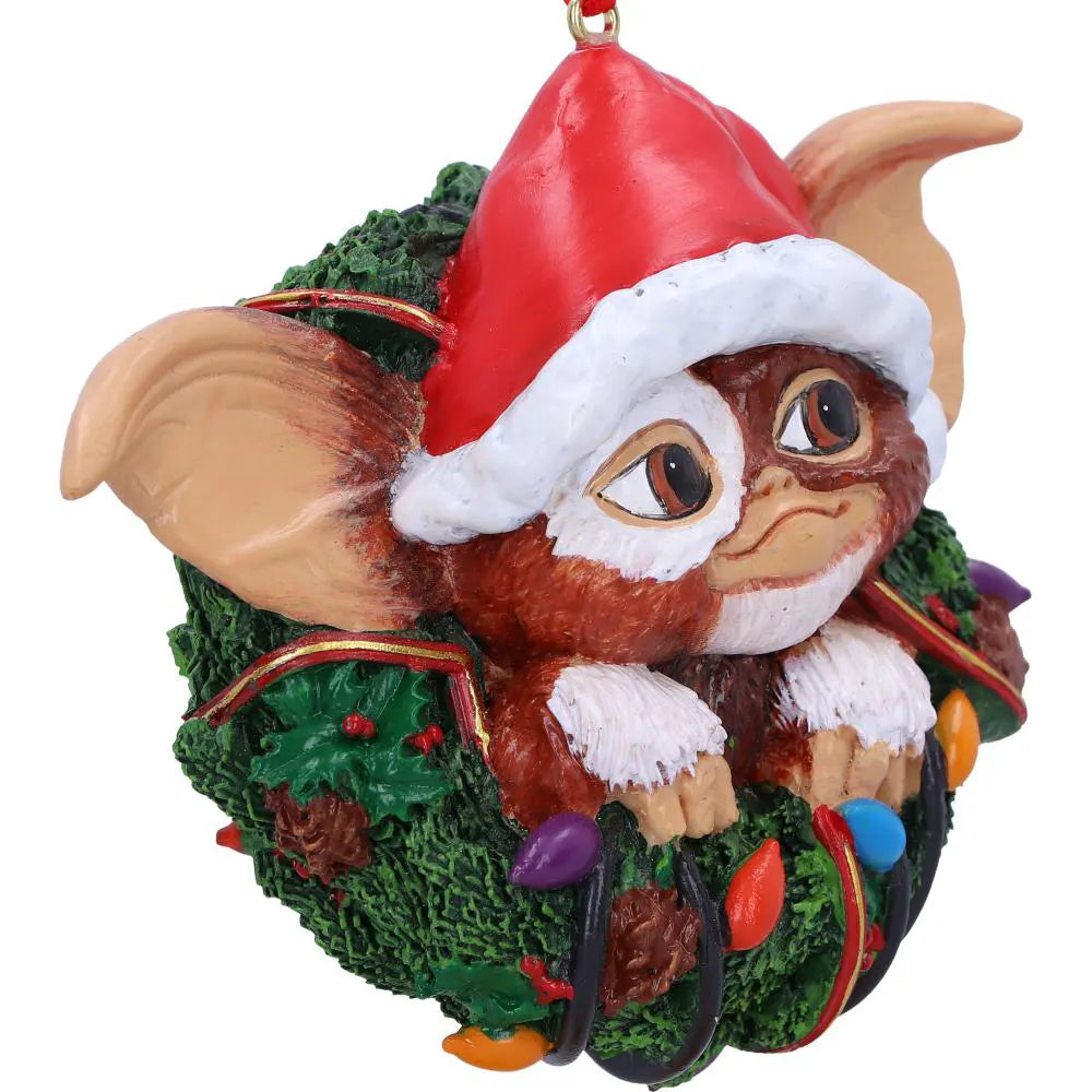 Close-up of Gizmo in decorated Christmas wreath with colourful lights