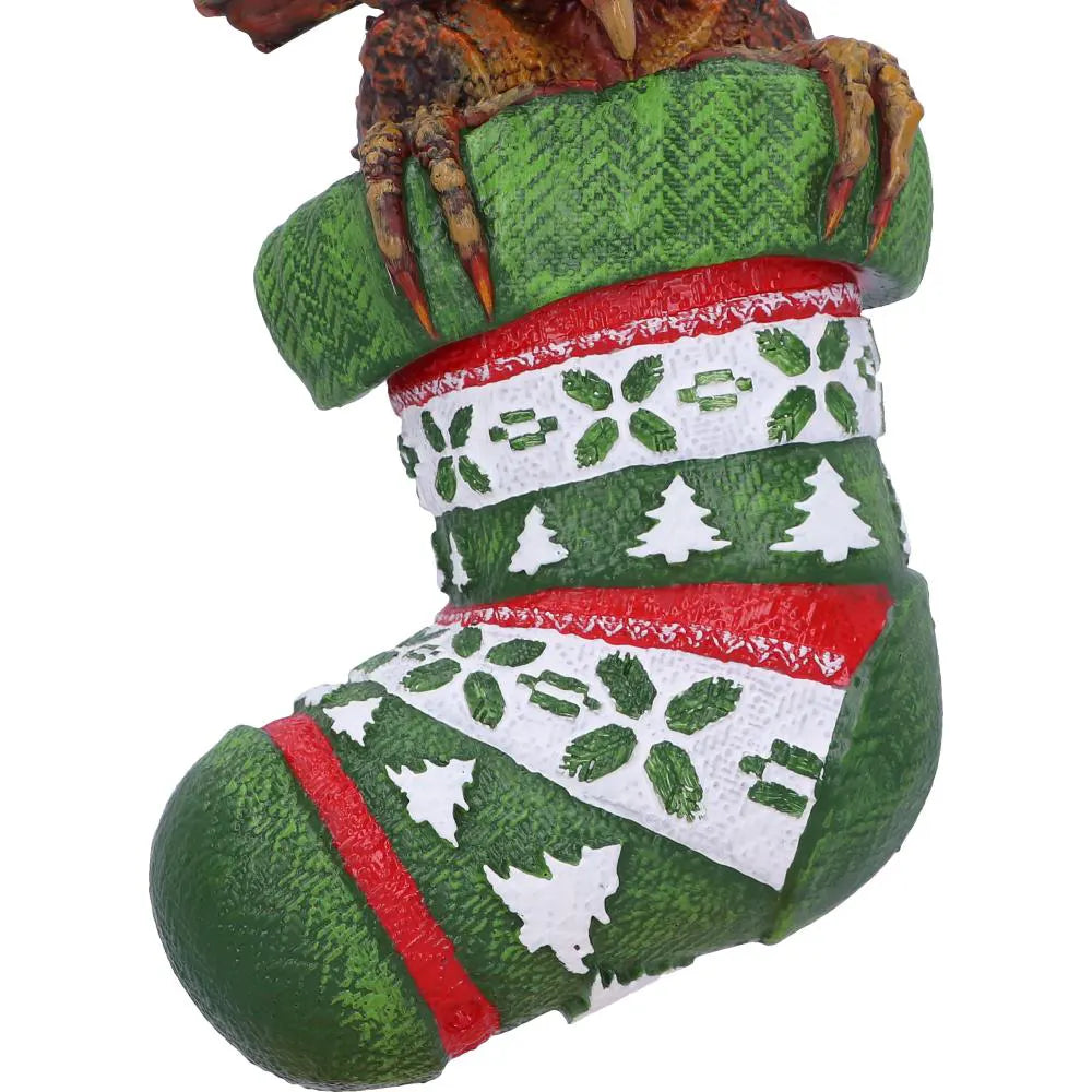 Close-up of festive knitted stocking with Mohawk Gremlin