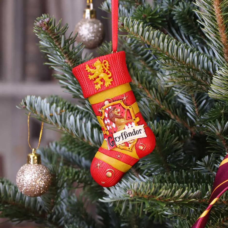 Gryffindor ornament hanging on Christmas tree branch