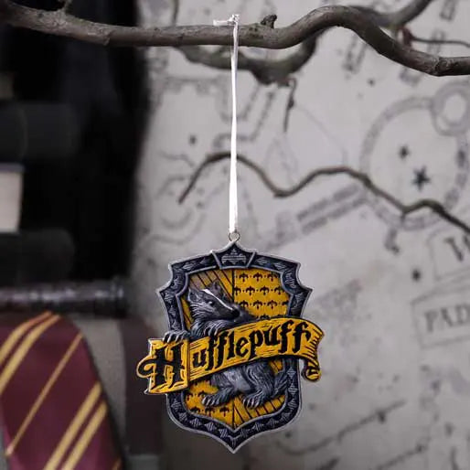 Hufflepuff ornament hanging on festive Christmas tree