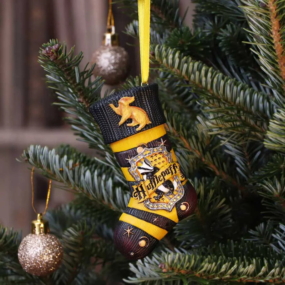 Hufflepuff stocking ornament hanging on a decorated Christmas tree with baubles