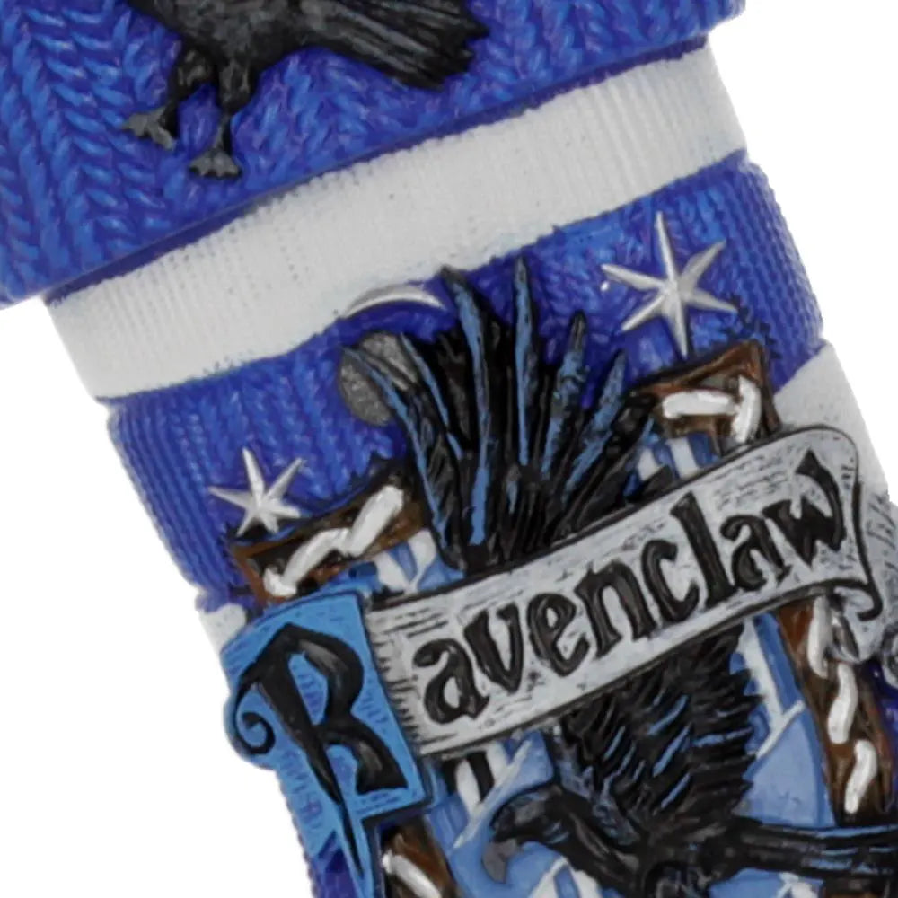 Close-up of Ravenclaw crest and raven on Christmas stocking ornament with fine detailing