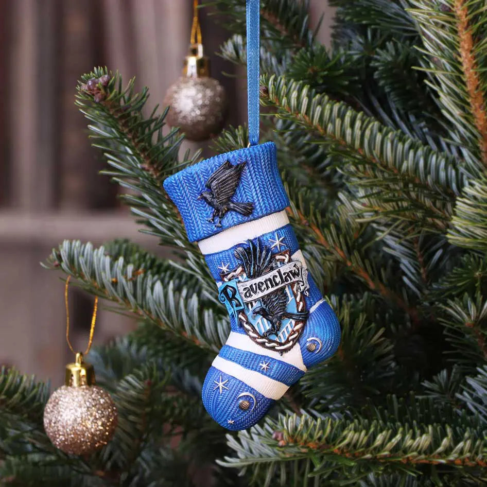 Ravenclaw stocking ornament hanging on a decorated Christmas tree with gold baubles