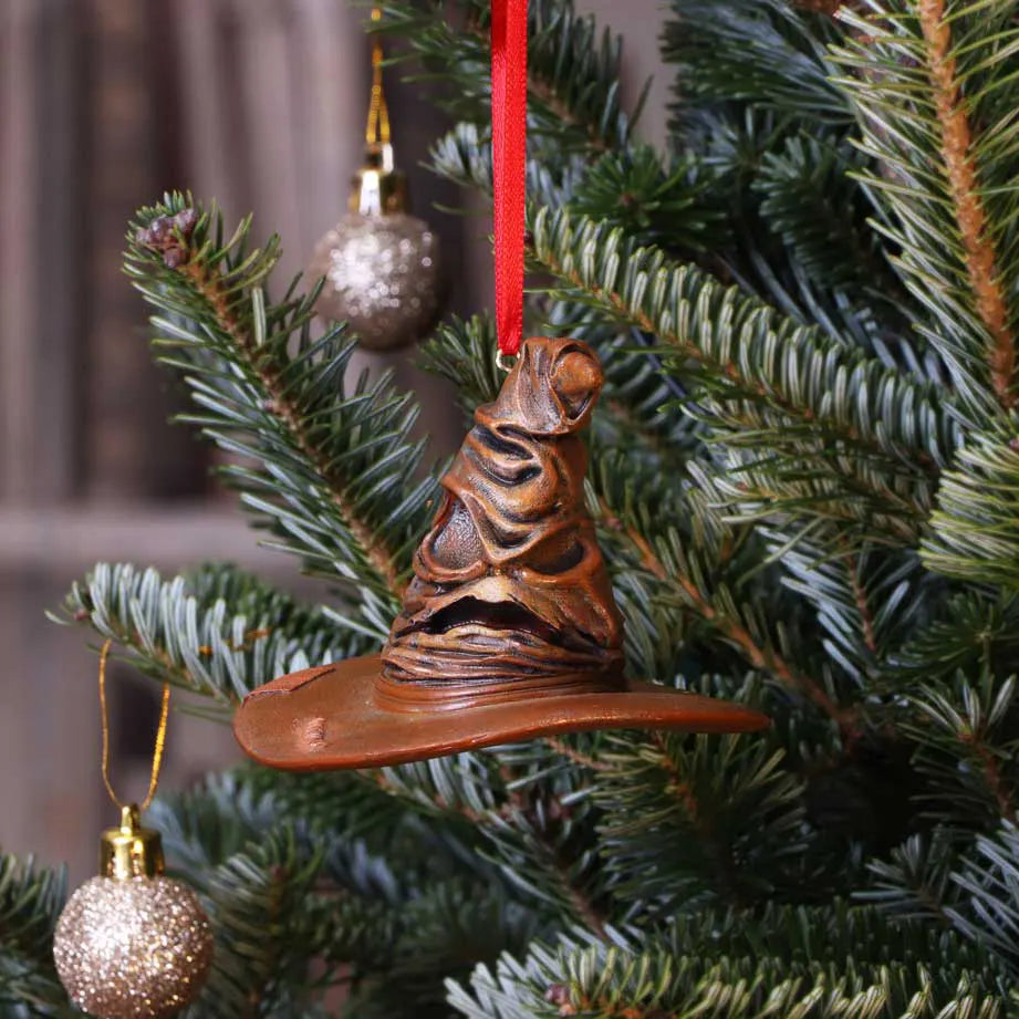 Hogwarts-themed holiday decoration on pine branch