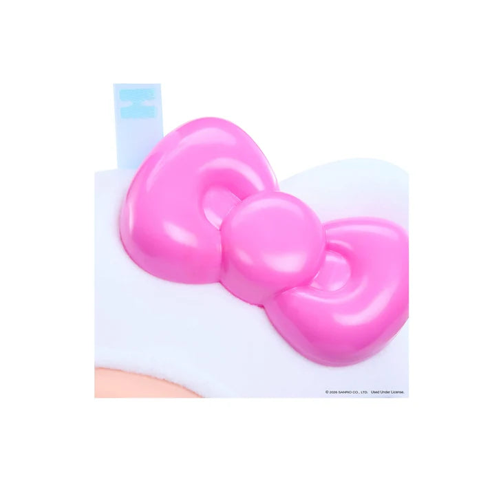Close-up of Hello Kitty Hyojo plush featuring a glossy pink bow and soft white fabric.