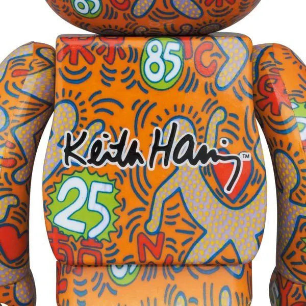 Back view of the Keith Haring v12 Bearbrick set, showing the full all-over print with dancing figures, hearts, and numbers “25” and “85.”