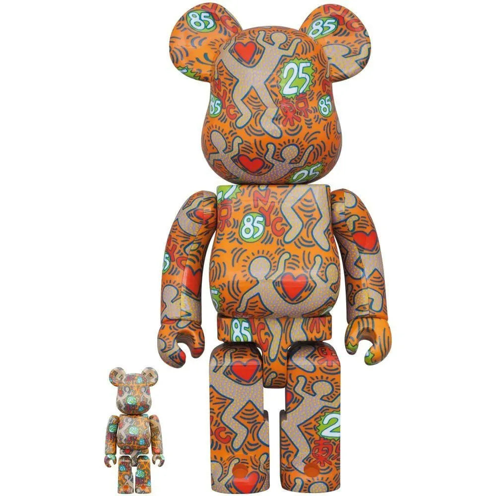 Front view of the 400% & 100% Bearbrick Set – Keith Haring v12 (BWWT 3) by Medicom Toy, featuring orange background and Keith Haring’s iconic heart and figure artwork.
