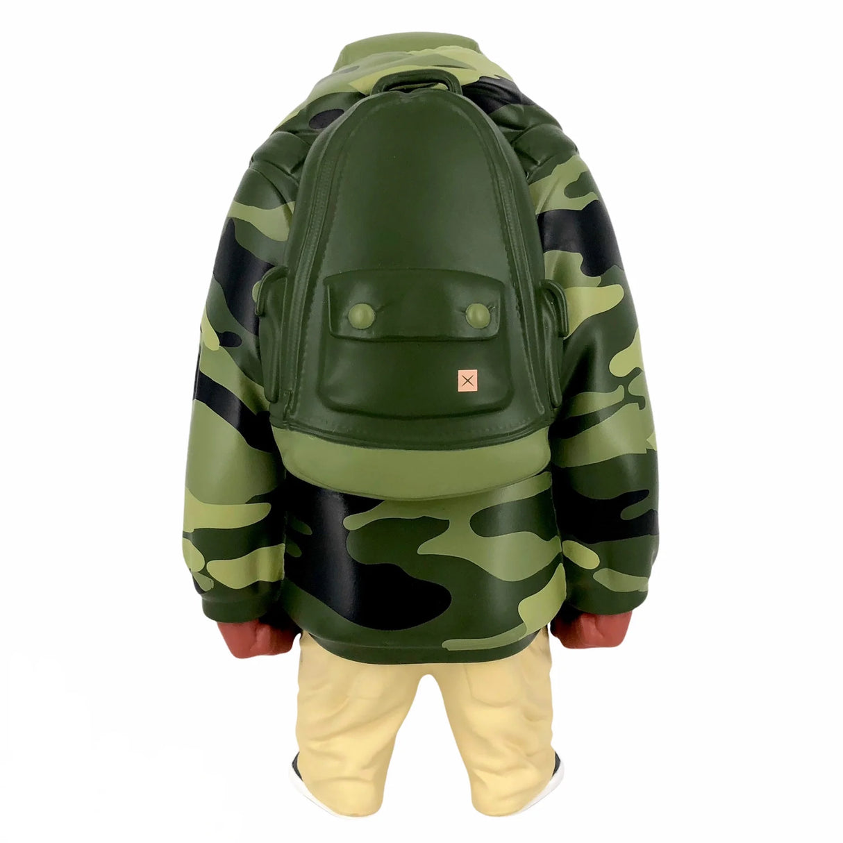 Side view of Kub vinyl toy showing detailed camo print and sculpted backpack