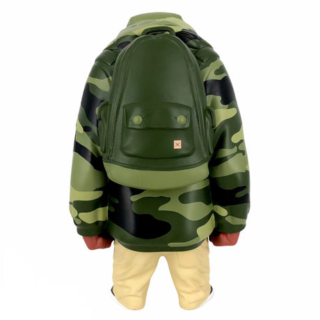 Side view of Kub vinyl toy showing detailed camo print and sculpted backpack
