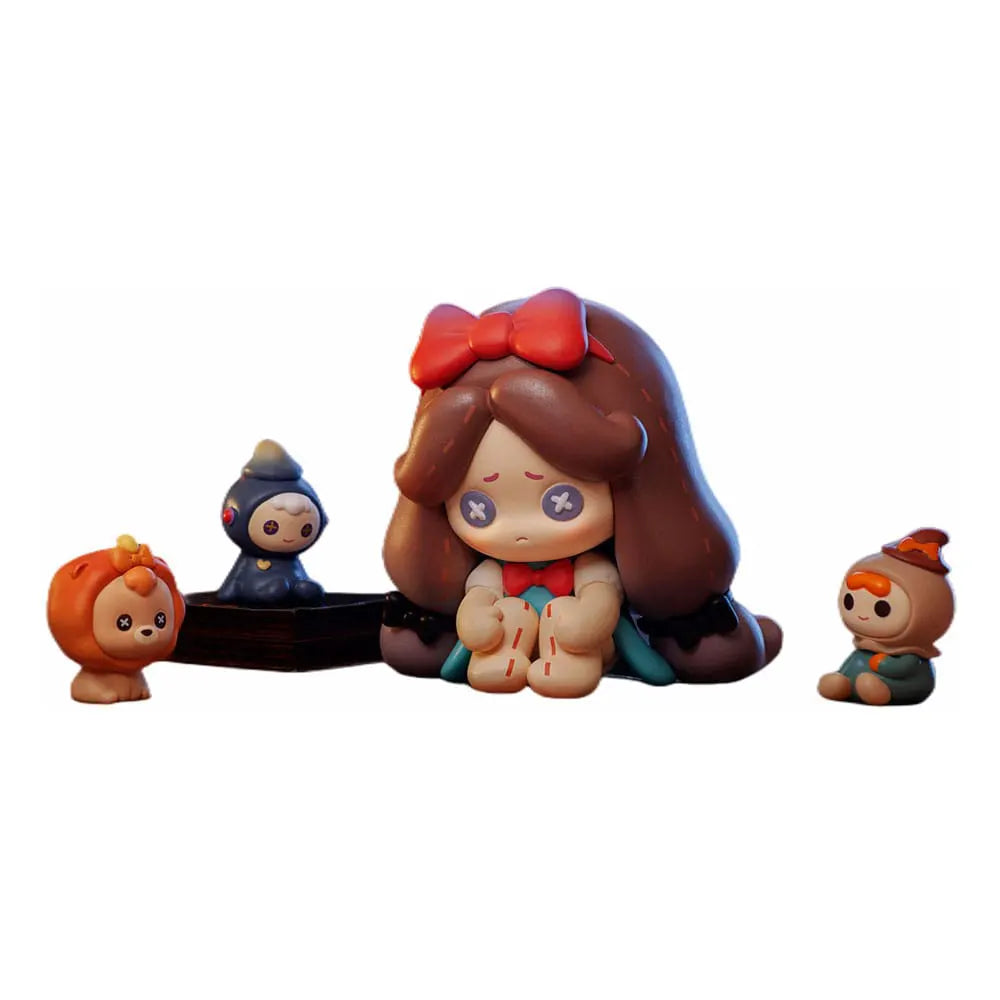 Sad Lilith figure surrounded by tiny Halloween characters from Monologue in the Land of OZ vinyl toy set