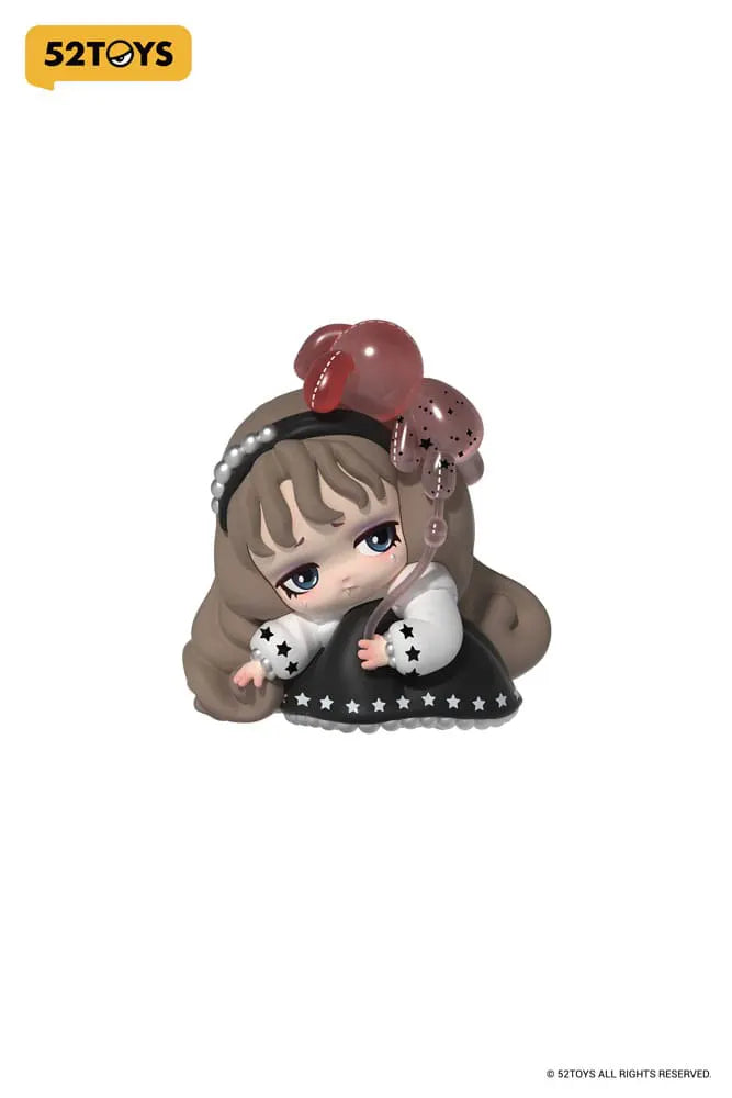 Lilith figure with star balloon and sad expression
