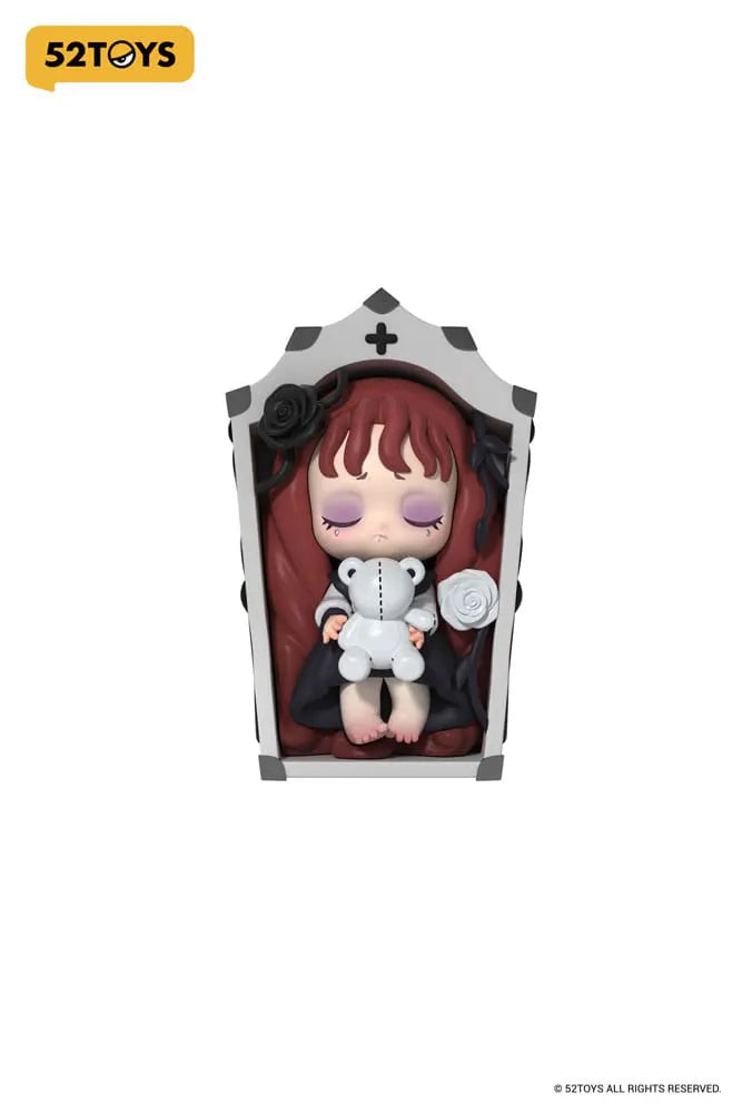 Sleeping Lilith in coffin with teddy bear