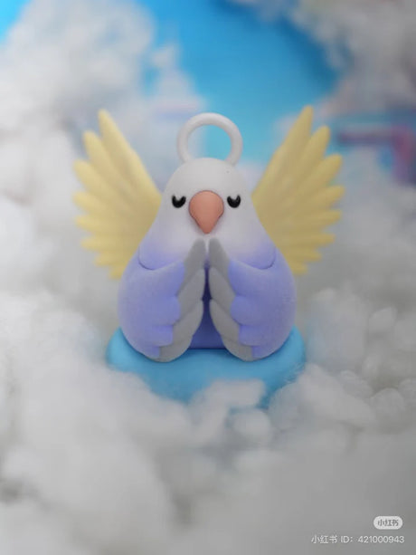 Angel Lovebird figure with golden wings and halo from Social Birdie Series