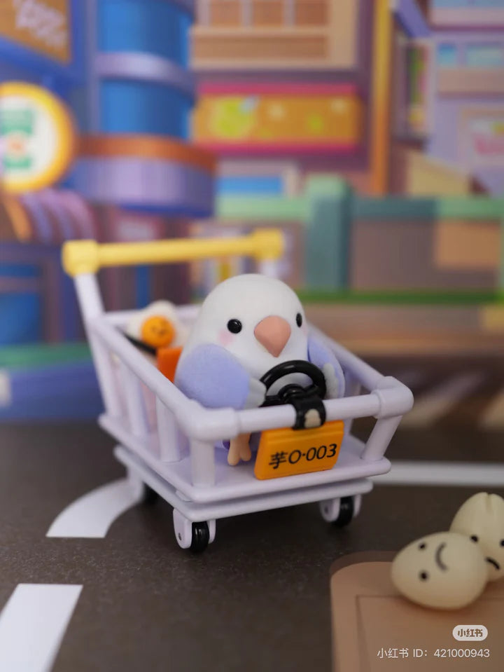 Lovebird Social Birdie figure driving a shopping cart with tiny details