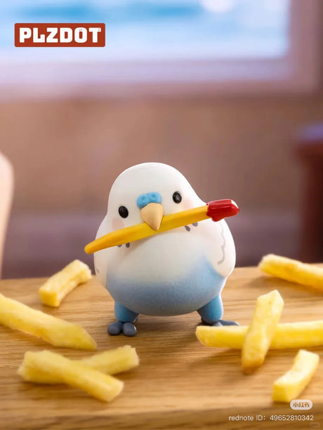Birdie Got Fries figure from the Lovebird Taroball blind box series holding a fry among scattered French fries.*
