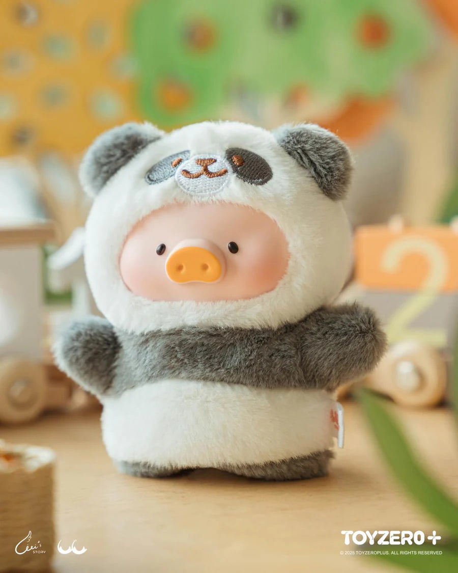 Close-up of LuLu the Piggy in a panda plush costume with keychain loop