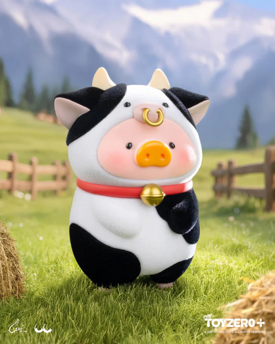 LuLu the Piggy wearing a cow costume with bell accessory from the Animal Party collection.