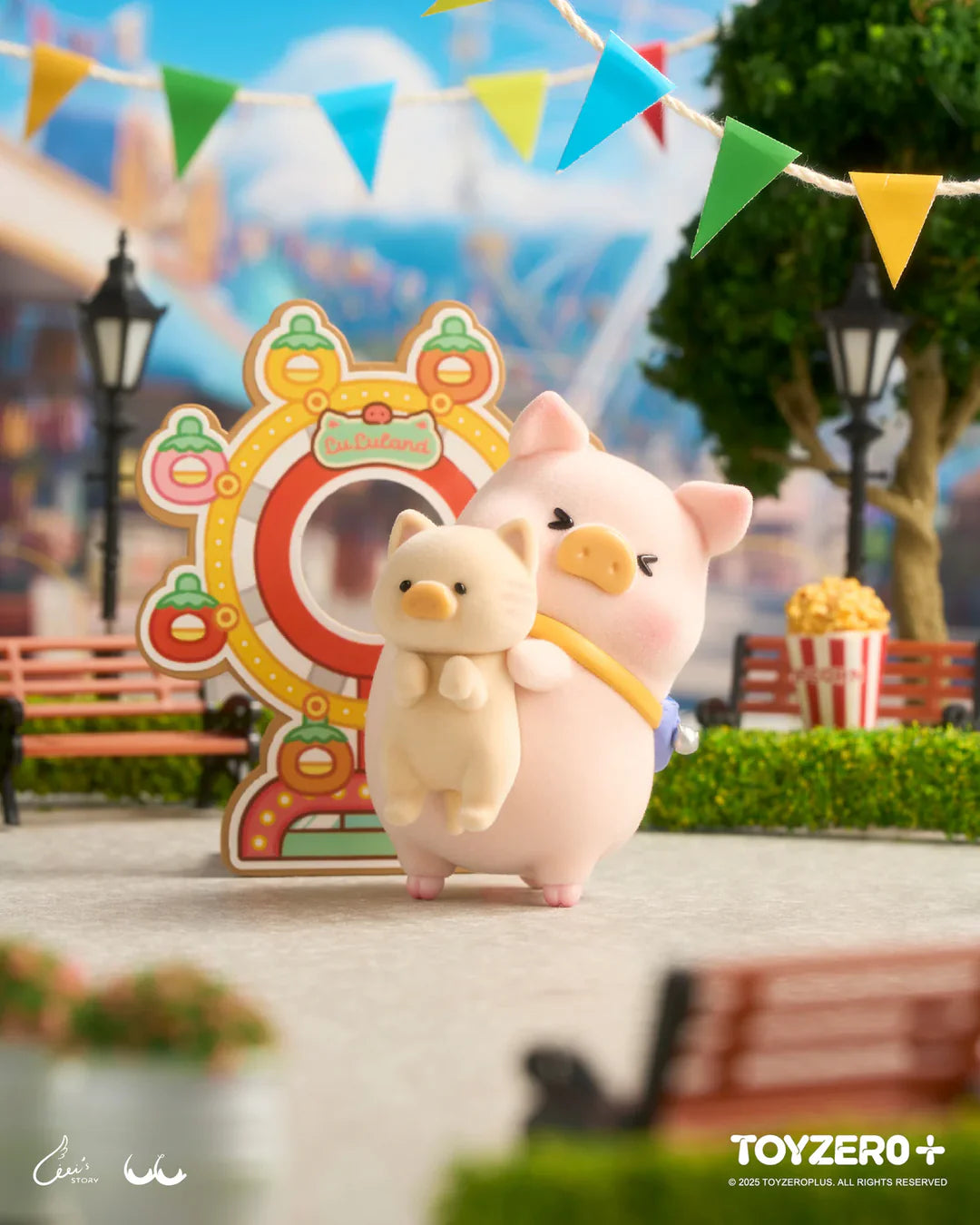 LuLu The Piggy hugging a cat friend beside a colorful carnival ferris wheel attraction